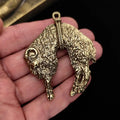 Golden Fleece pendant replica in a hand, showing double-sided relief.