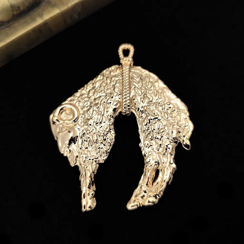 Golden Fleece pendant in gold plated  finish on black background.