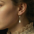 Alexandrine Earrings on an ear model close up