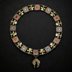 Full view of Renaissance style Golden Fleece livery collar forming a circle on a blackened gesso background