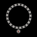 Upper view of a round Livery Collar with square cabochons and Round Medallion pendant on a pure black background