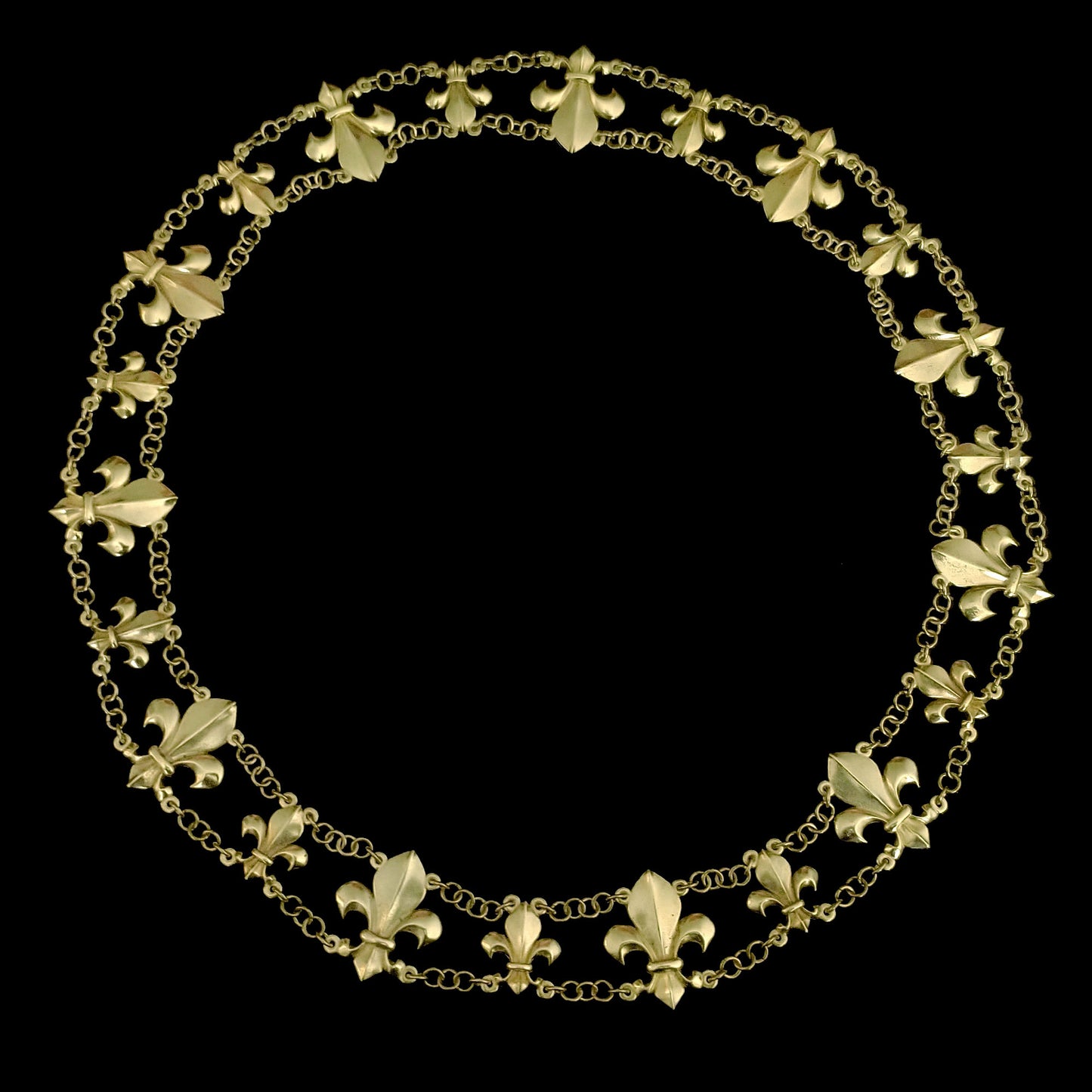 Featuring a brass finish and a classic fleur de Lis design, this Chain of Office commands attention and adds a touch of elegance to any ensemble. Visible from an upper view against a black background, its intricate details and regal appearance make it perfect for formal events and ceremonies.