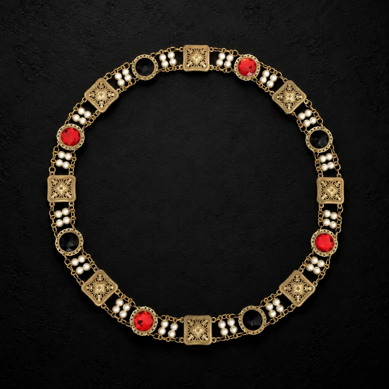 Total upper view of Ambrossio chain of foffice in brass finish with two strand of pearls between connectors and settings with color cabochons