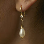 Very Close up of Alesandrine earrings on an ear model